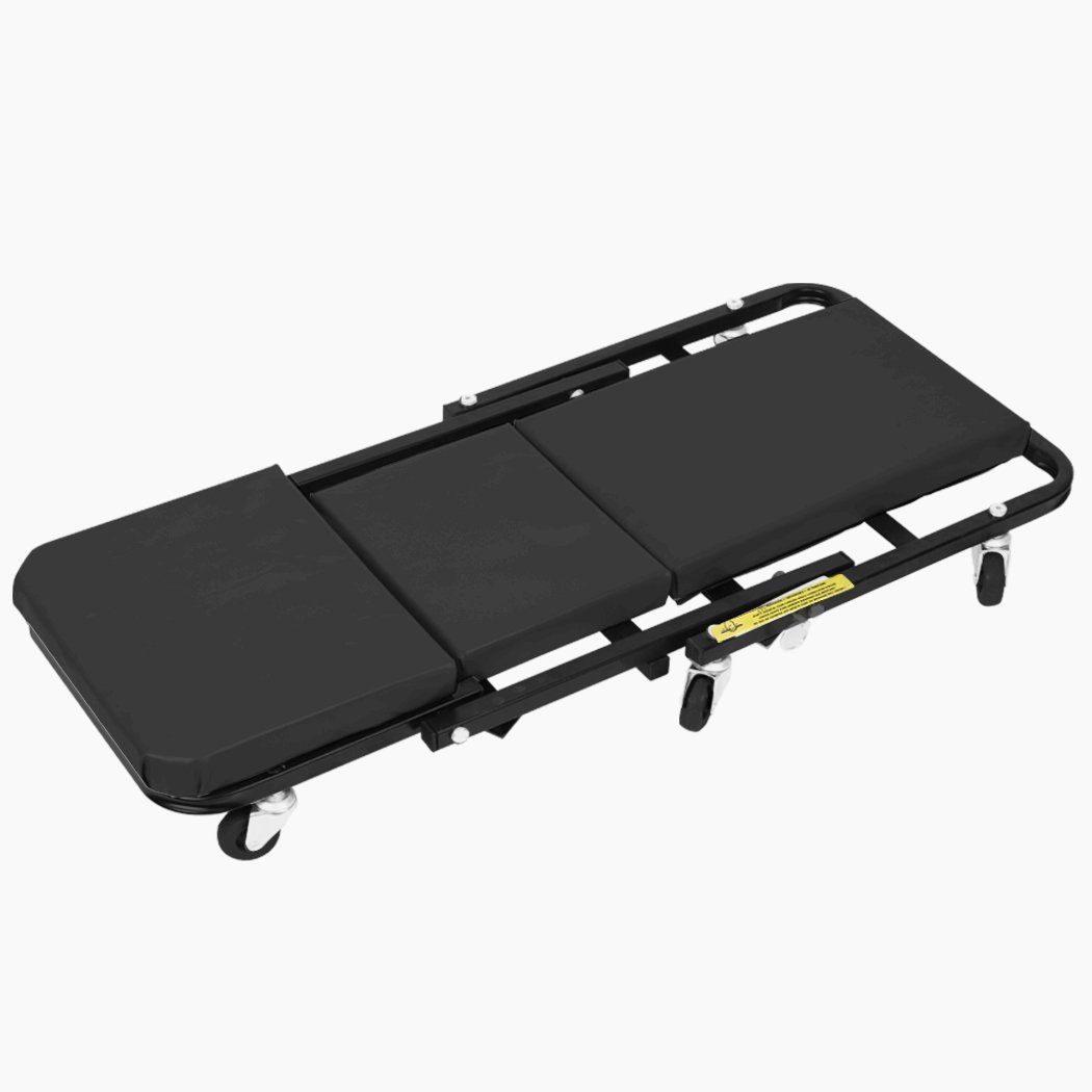 Folding Creeper Mechanic Stool with plush surface and ergonomic wheels, designed for garage repairs.