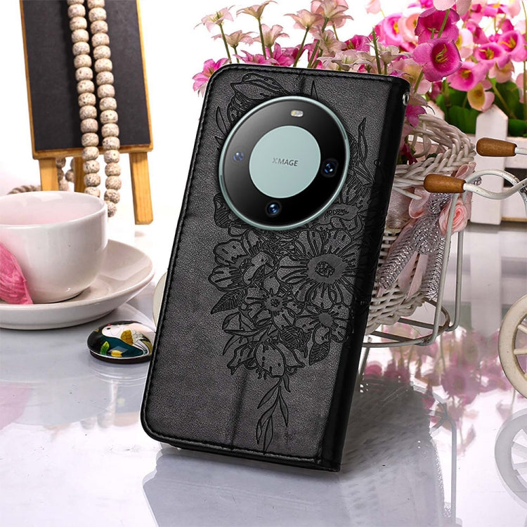 Black embossed butterfly leather phone case designed for Huawei Mate 60, showcasing its elegant design and functional features.