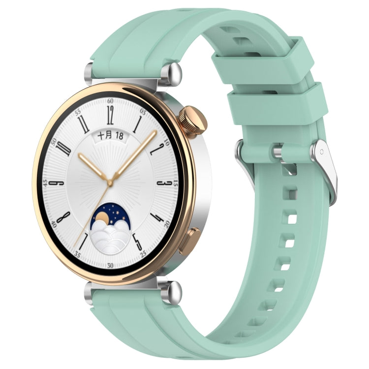 Stylish silver buckle silicone strap for Huawei Watch GT4 41mm, showcasing its soft texture and elegant design.