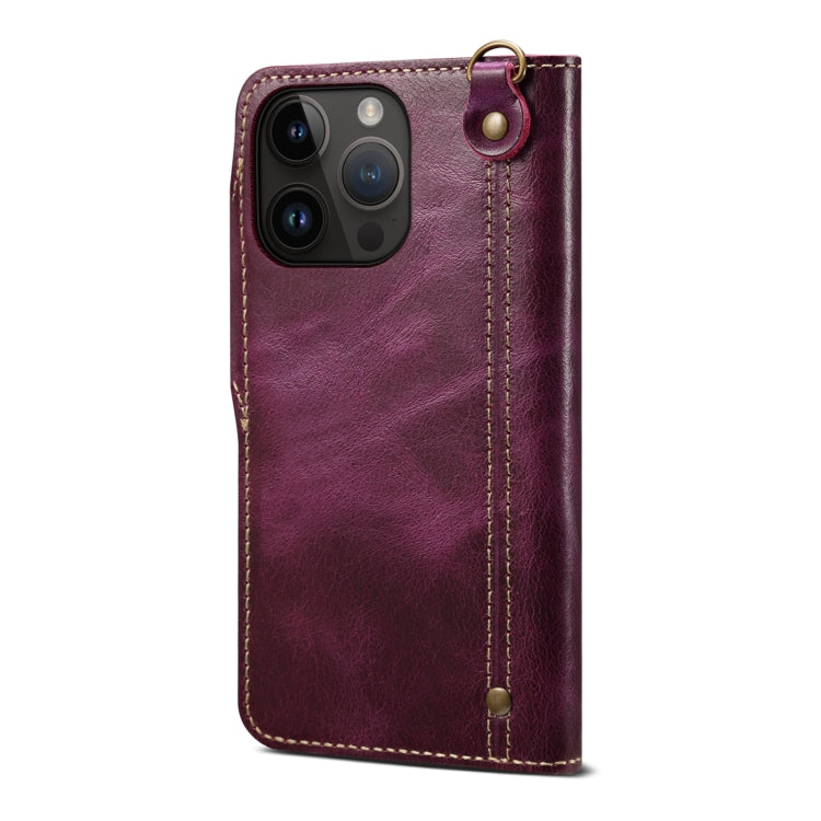 Denior Oil Wax Cowhide Magnetic Button Genuine Leather Case for iPhone 13, showcasing its luxurious texture and card slots.