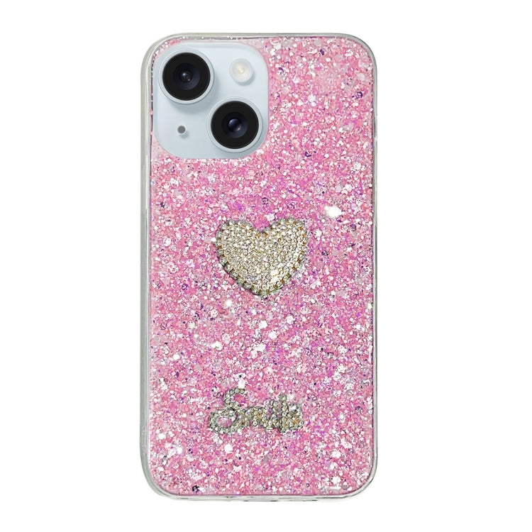 Pink epoxy TPU phone case for iPhone 15 featuring a starry sequin diamond heart design, showcasing durability and style.
