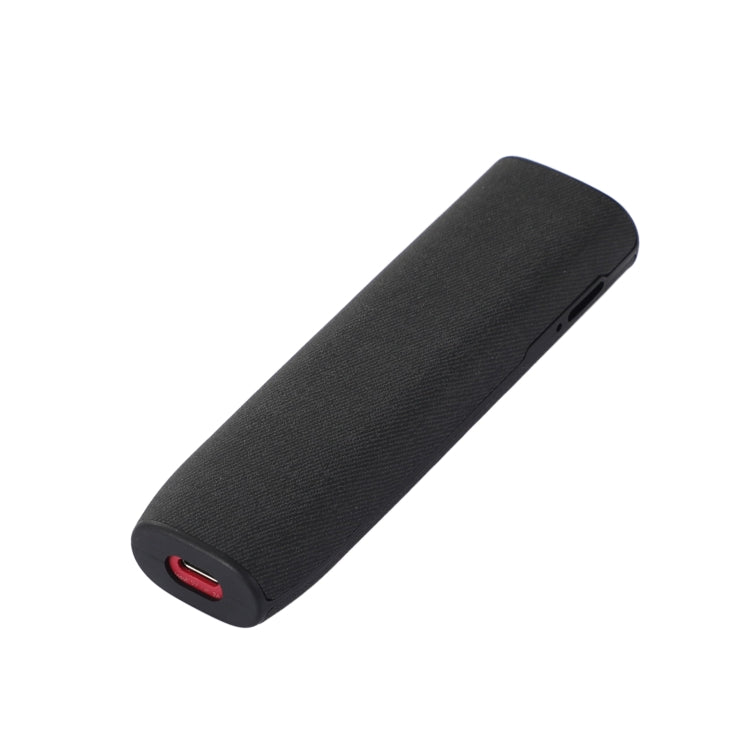 Black cylindrical portable Bluetooth speaker.