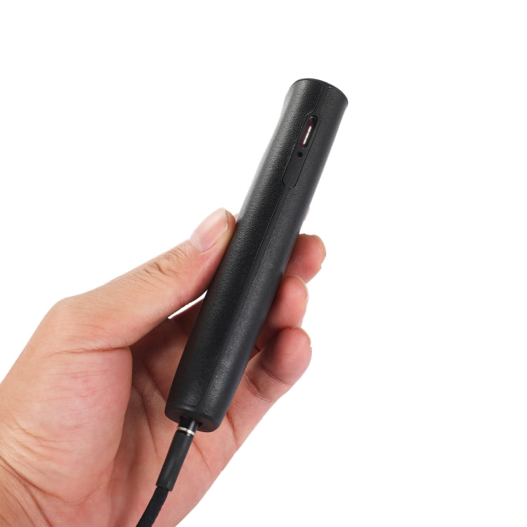 Hand holding a black microphone.