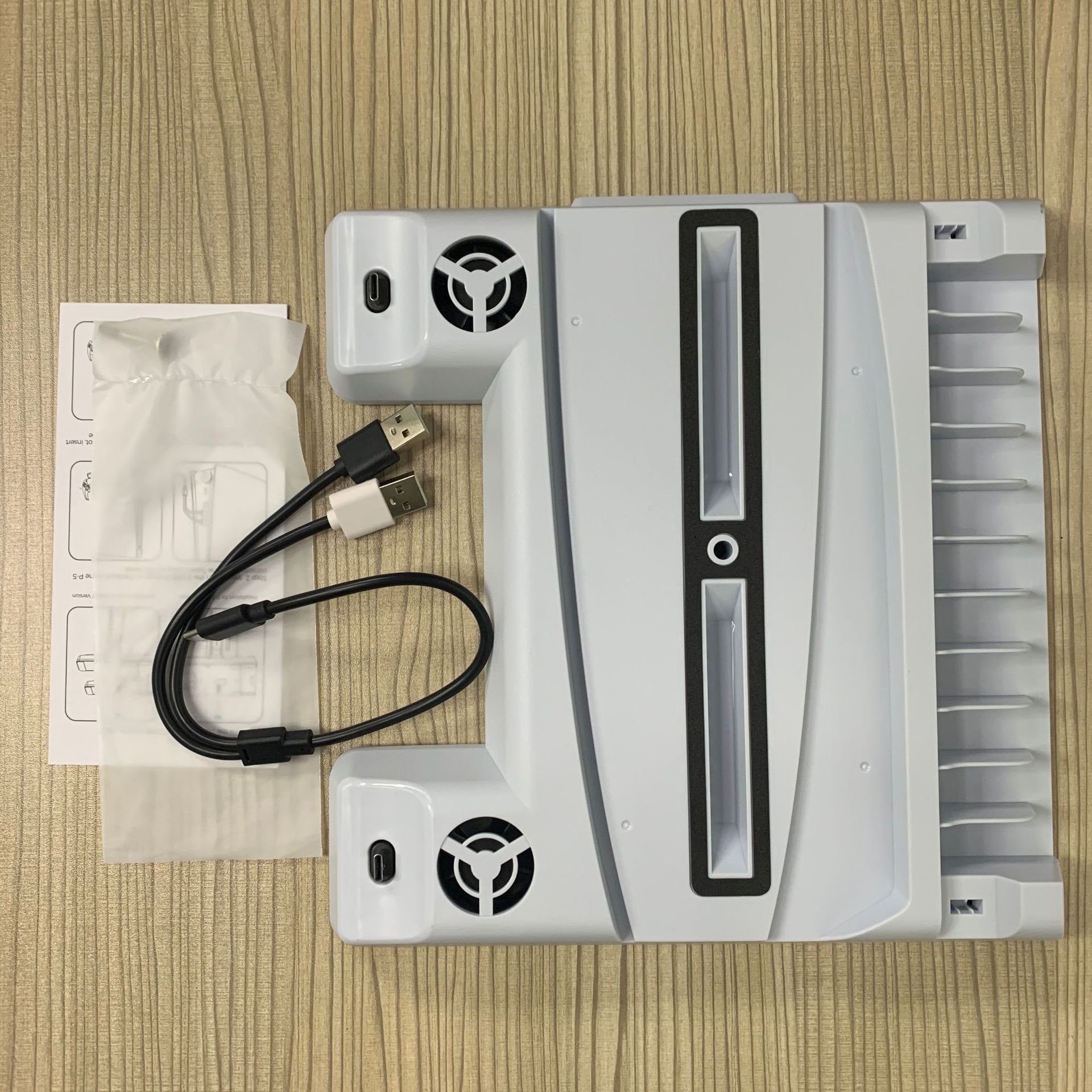 PS5 DE/UHD Vertical Stand with Cooling Fan and Charging Dock, featuring an earphone holder and sleek design.