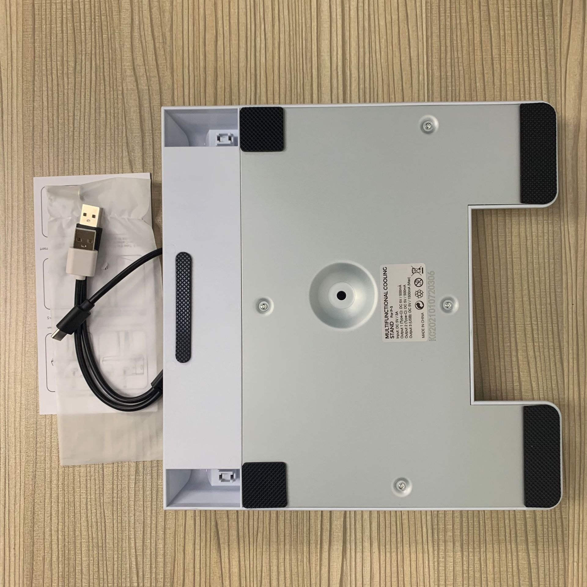 PS5 DE/UHD Vertical Stand with Cooling Fan and Charging Dock, featuring an earphone holder and sleek design.