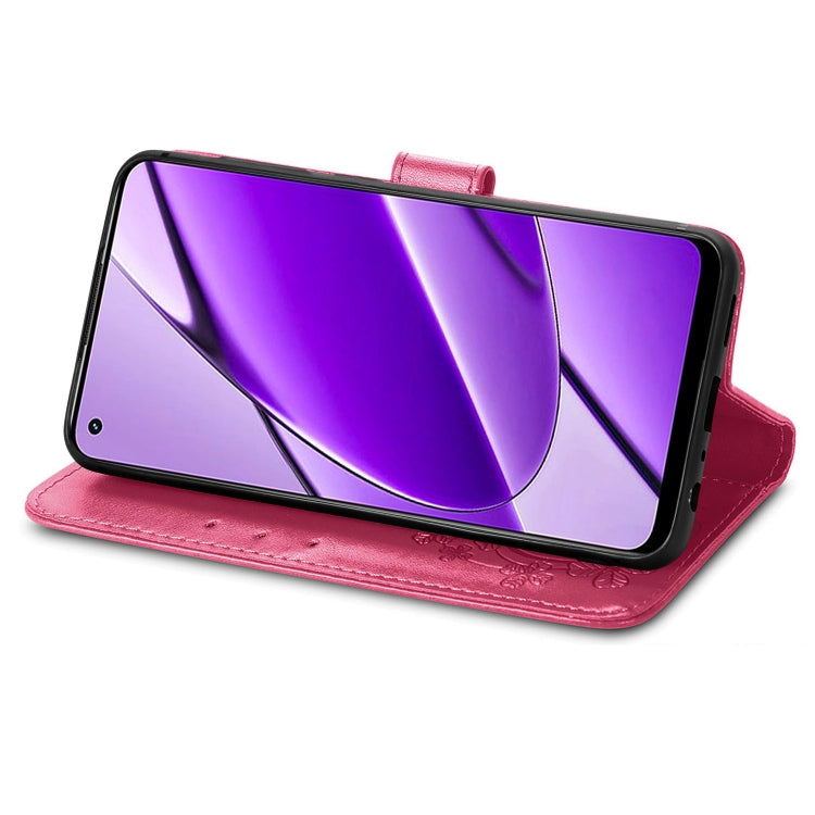 For Realme 11 4G leather phone case featuring a four-leaf clover embossed design and a buckle, showcasing its elegant and functional features.