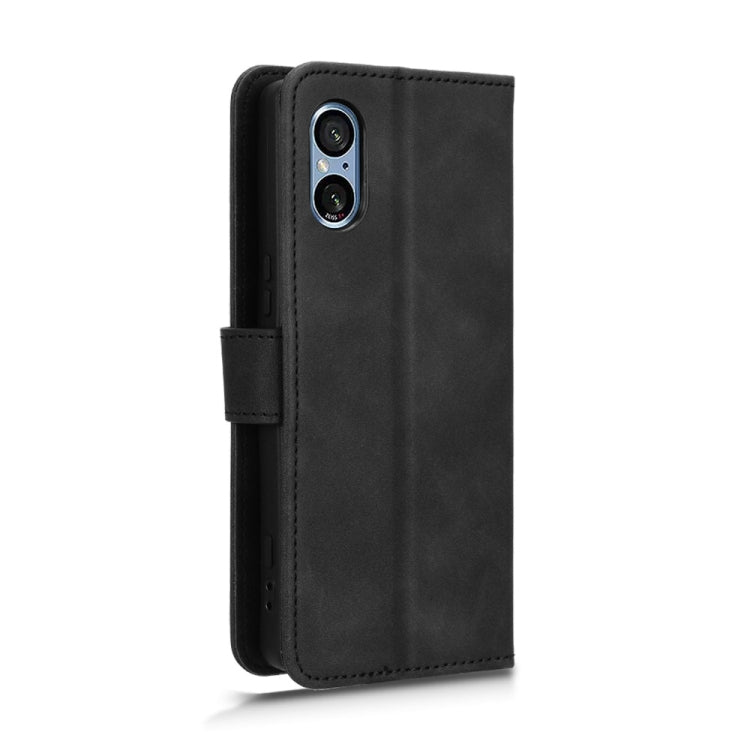For Sony Xperia 5 V 2023 magnetic flip leather phone case in black, showcasing its sleek design and card slots.
