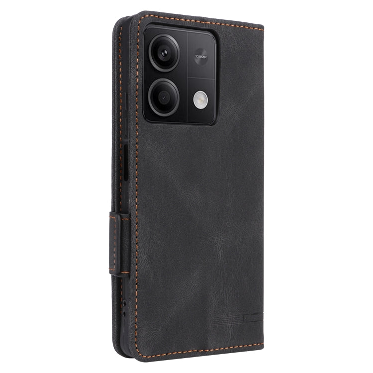 Black magnetic clasp leather phone case for Xiaomi Redmi Note 13 5G, showcasing its sleek design and card slot feature.