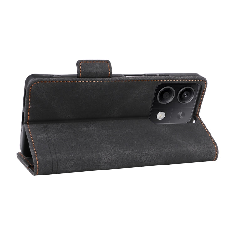 Black magnetic clasp leather phone case for Xiaomi Redmi Note 13 5G, showcasing its sleek design and card slot feature.