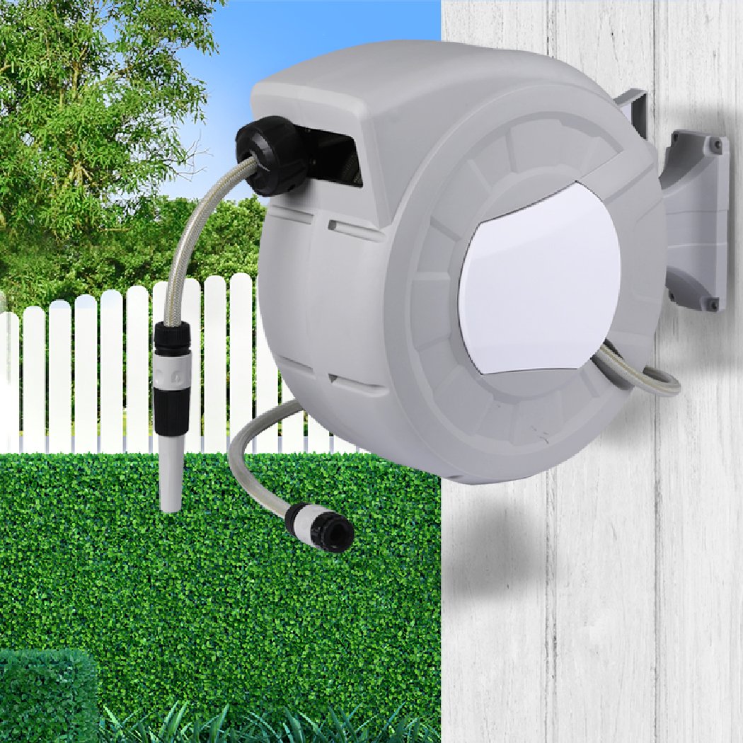 Retractable garden hose reel with spray gun nozzle mounted on a wall, showcasing its ergonomic design and durable construction.