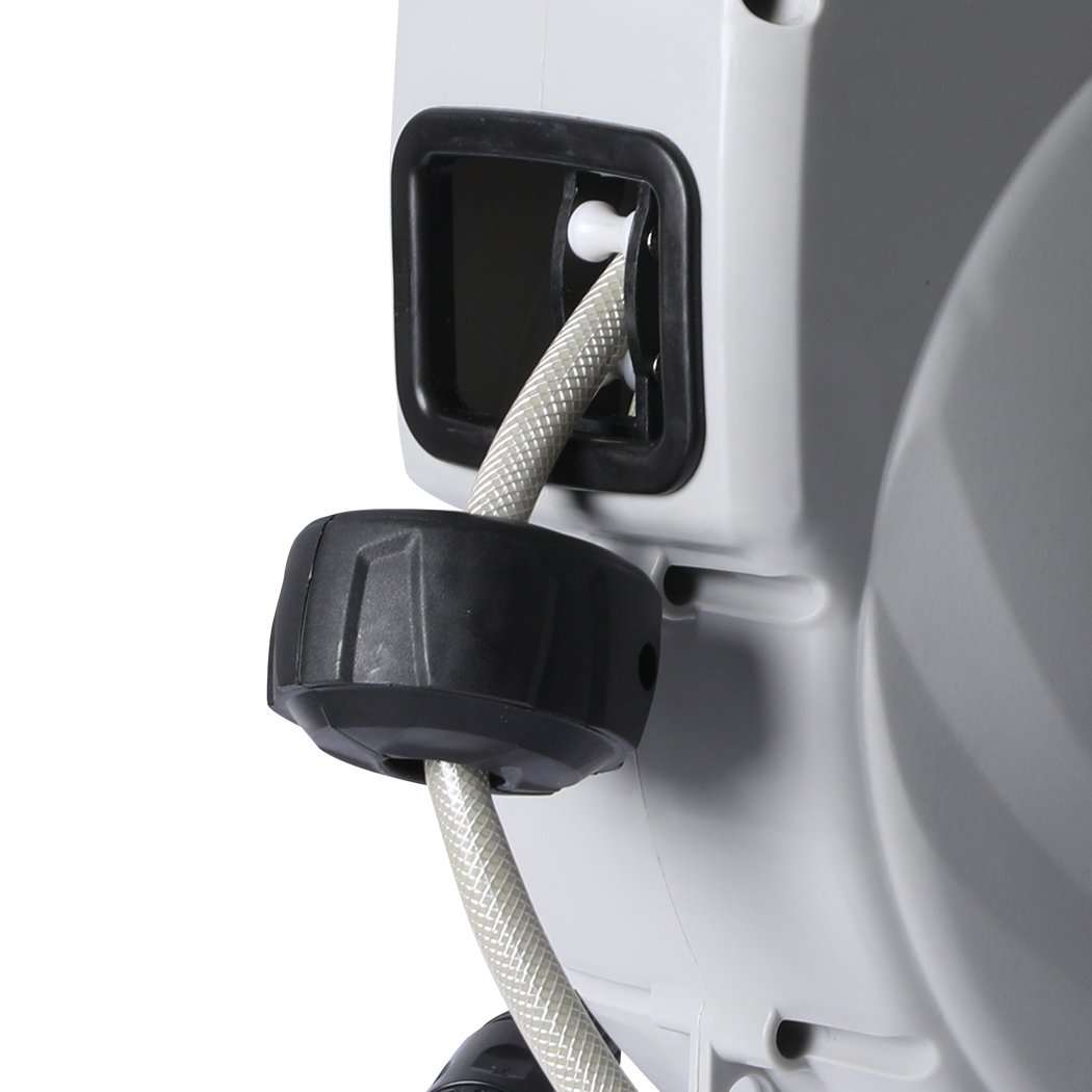 Retractable garden hose reel with spray gun nozzle and wall bracket, showcasing its durable design and ergonomic features.