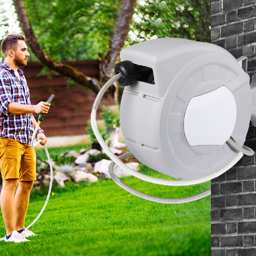 Retractable garden hose reel with spray gun nozzle and wall bracket, showcasing its durable design and ergonomic features.