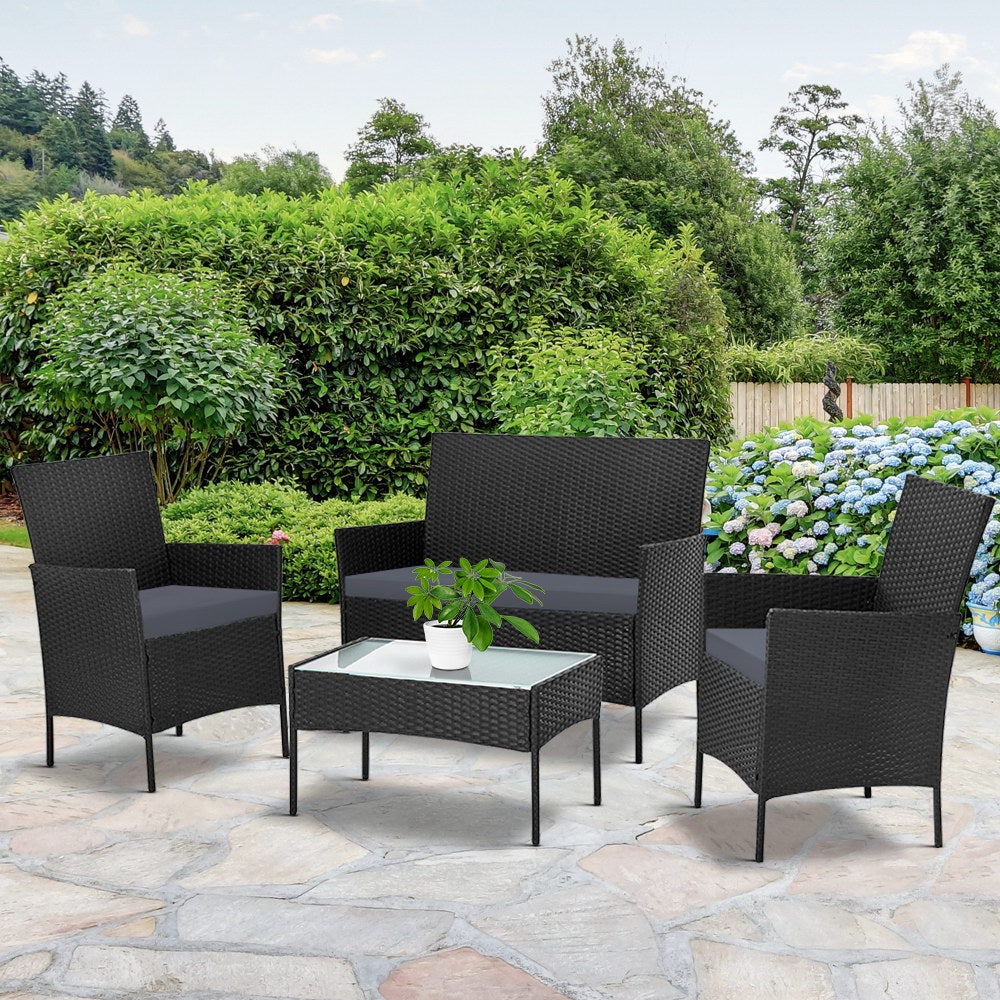 Gardeon 4-piece Wicker Outdoor Set in Black featuring a loveseat, two armchairs, and a side table with grey cushions.