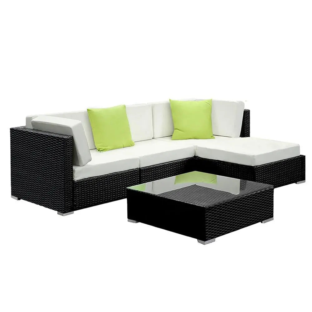 Gardeon 5PC Outdoor Sofa Set featuring black aluminium frame, beige cushions, and lime green throw pillows, with a glass-topped table and storage cover.