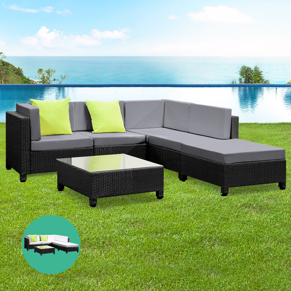 Gardeon 6pcs Outdoor Sofa Lounge Setting featuring modular design with grey cushions, black frame, and a glass-top coffee table, perfect for outdoor gatherings.