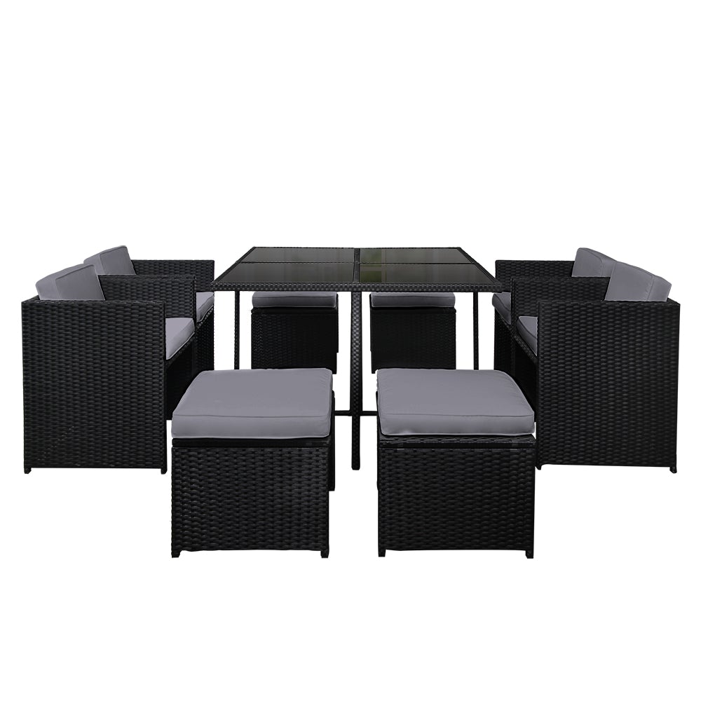 Gardeon 9 Piece Wicker Outdoor Dining Set featuring black and grey cushions, a glass top table, and stylish wicker design, perfect for outdoor dining.