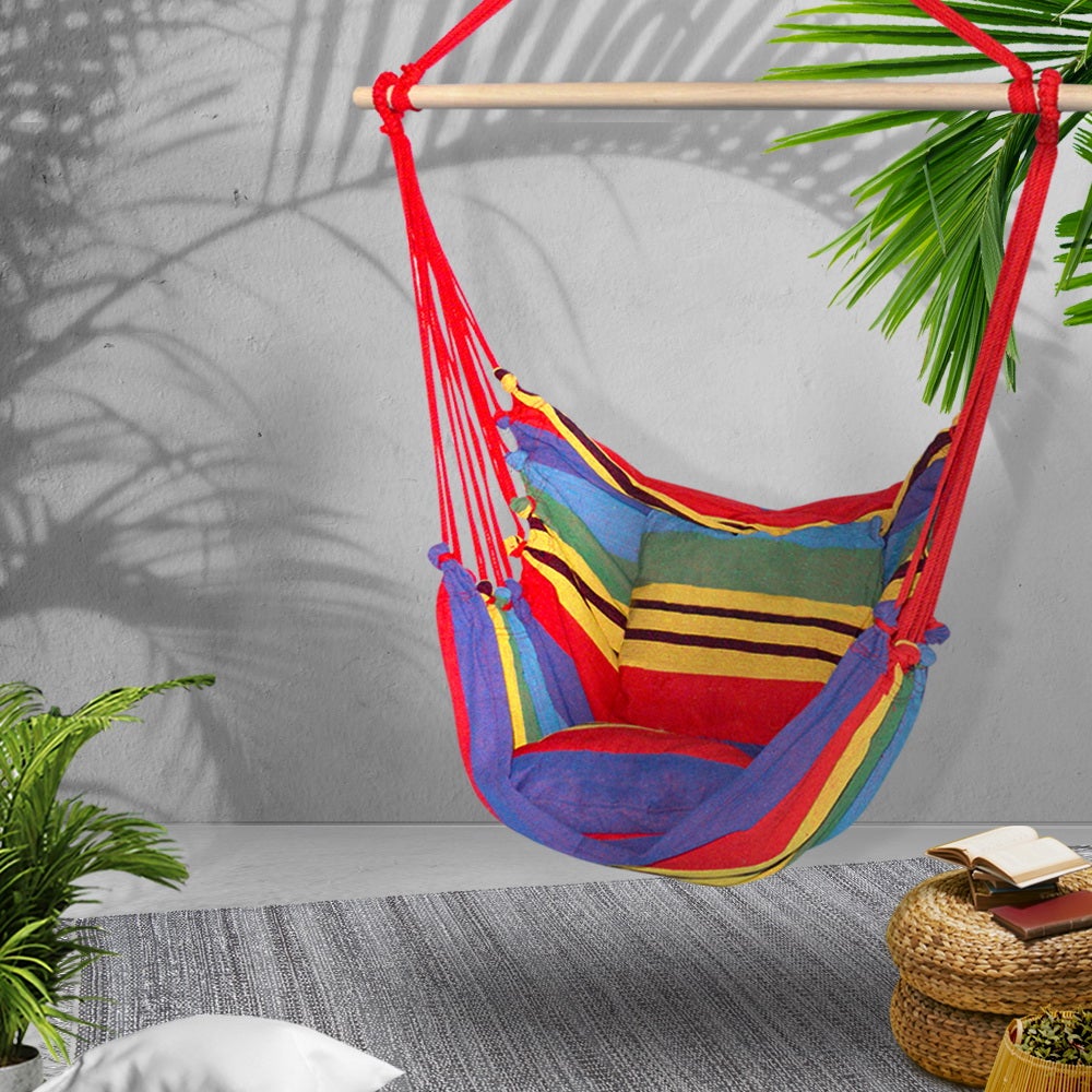 Gardeon Hammock Swing Chair with vibrant multi-colour cushions, hanging from a timber rail, perfect for outdoor relaxation.
