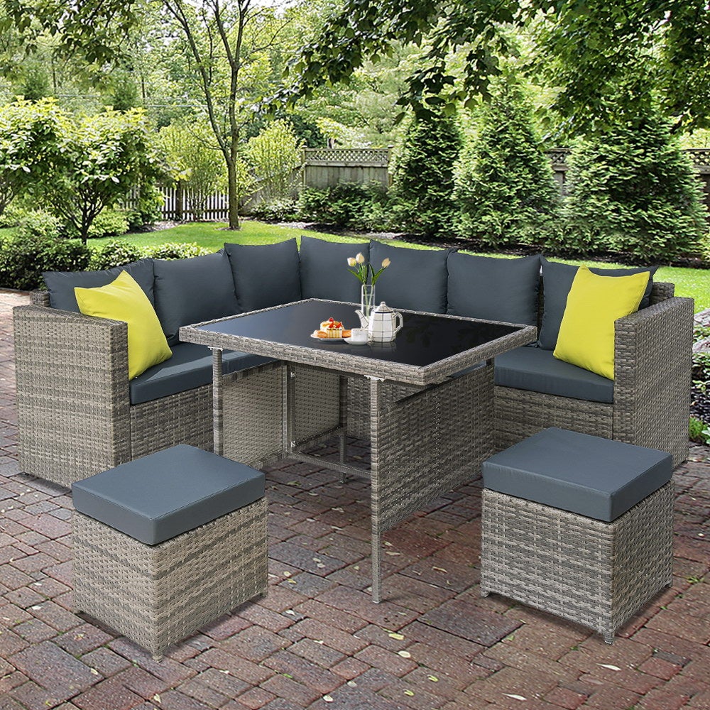 Gardeon Outdoor Furniture Patio Set featuring a stylish sofa, table, and lounge chairs in a garden setting, showcasing its modern design and comfort.