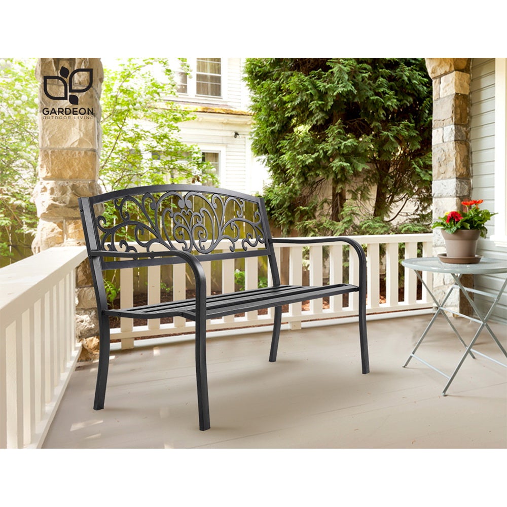 Gardeon Outdoor Garden Bench in Black with Victorian-inspired design and floral-patterned backrest, set in a garden.