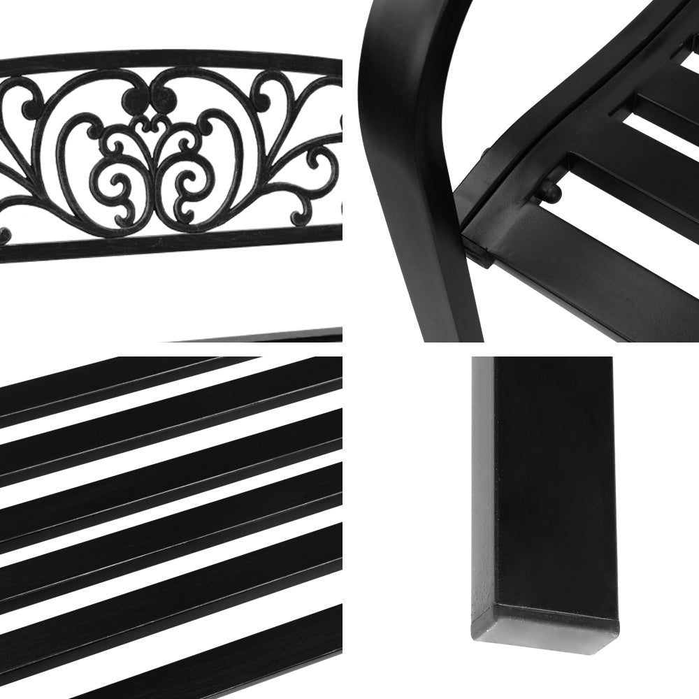 Gardeon Outdoor Garden Bench in Black with Victorian-inspired design and floral-patterned backrest, set in a garden.