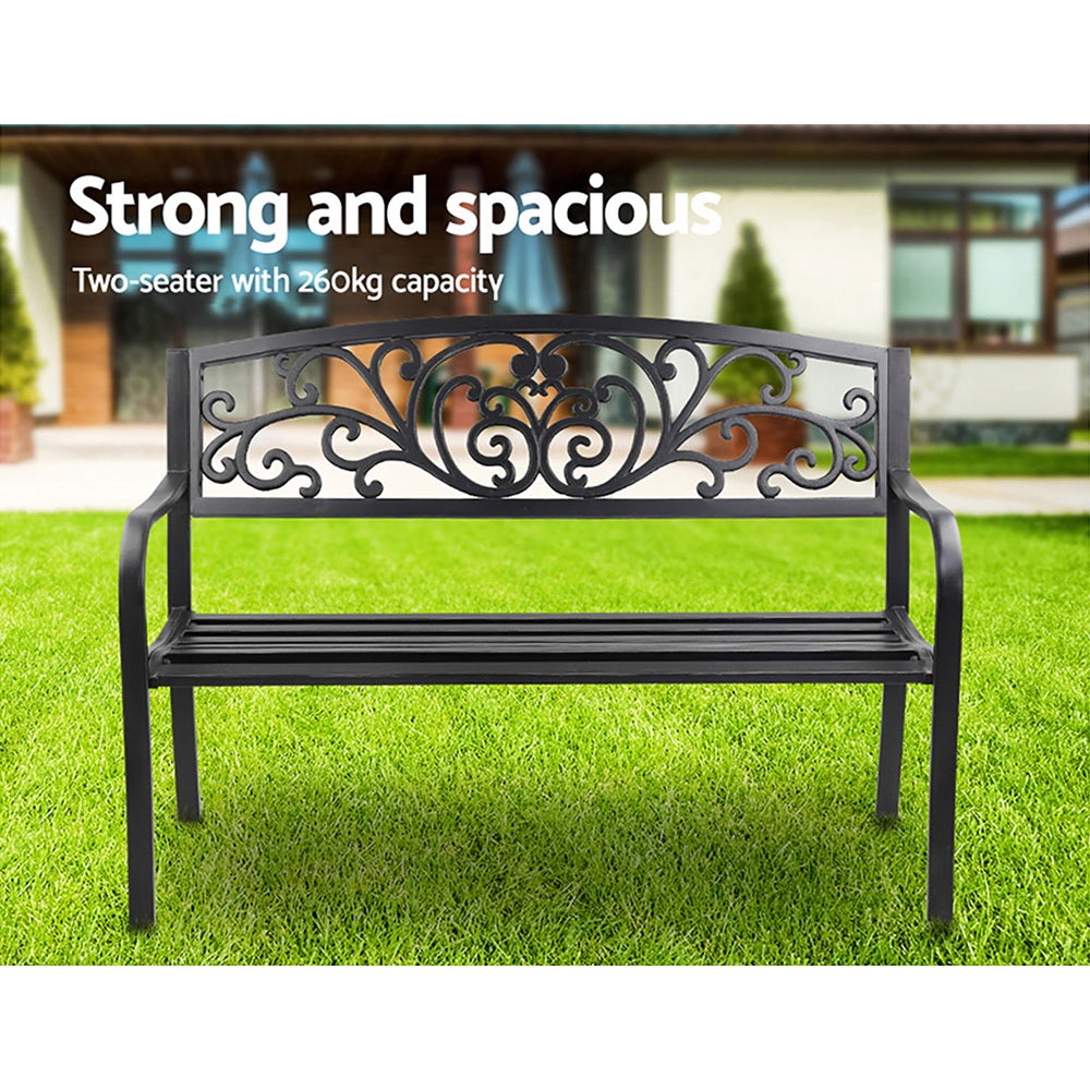 Gardeon Outdoor Garden Bench in Black with Victorian-inspired design and floral-patterned backrest, set in a garden.