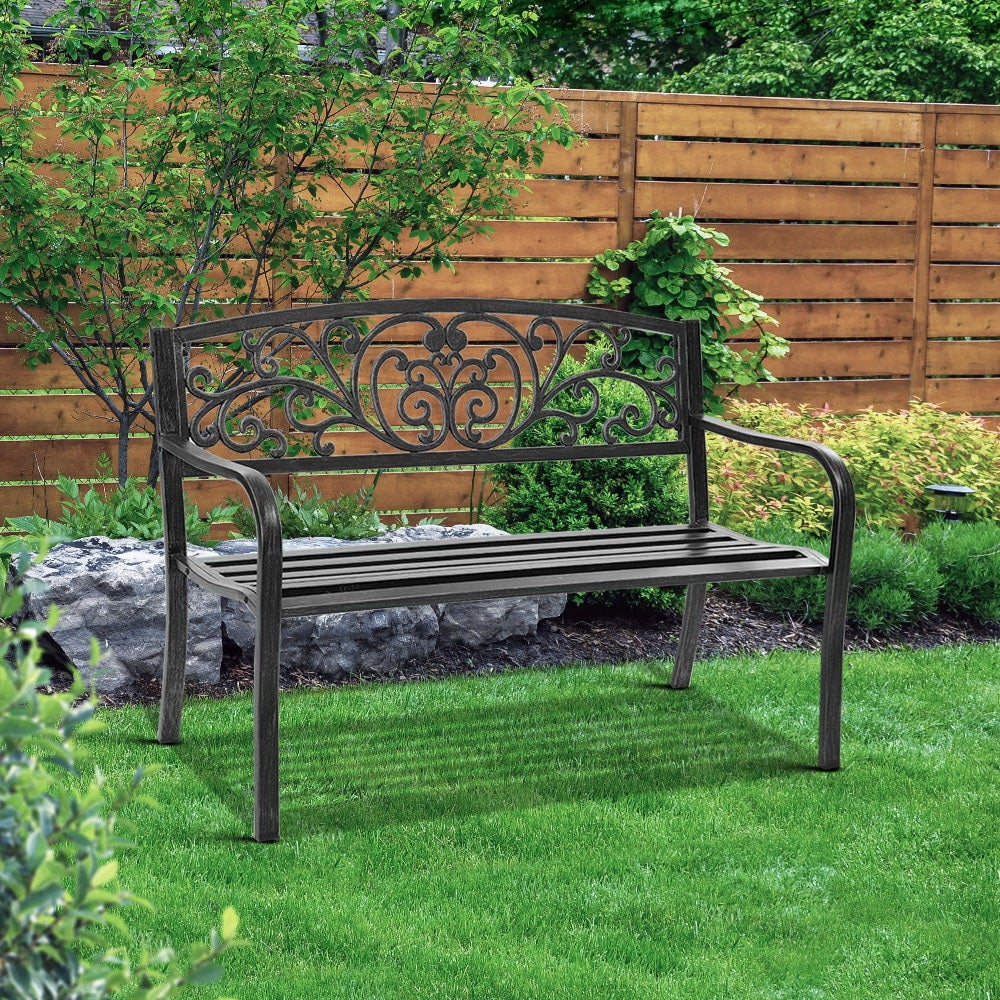 Gardeon Outdoor Garden Bench in Black with Victorian-inspired design and floral-patterned backrest, set in a garden.