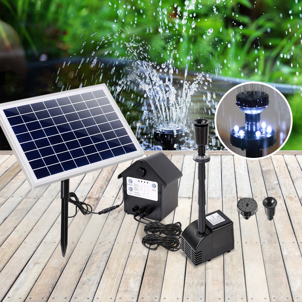 Gardeon Solar Pond Pump with LED lights, showcasing a beautiful water display in a garden setting.