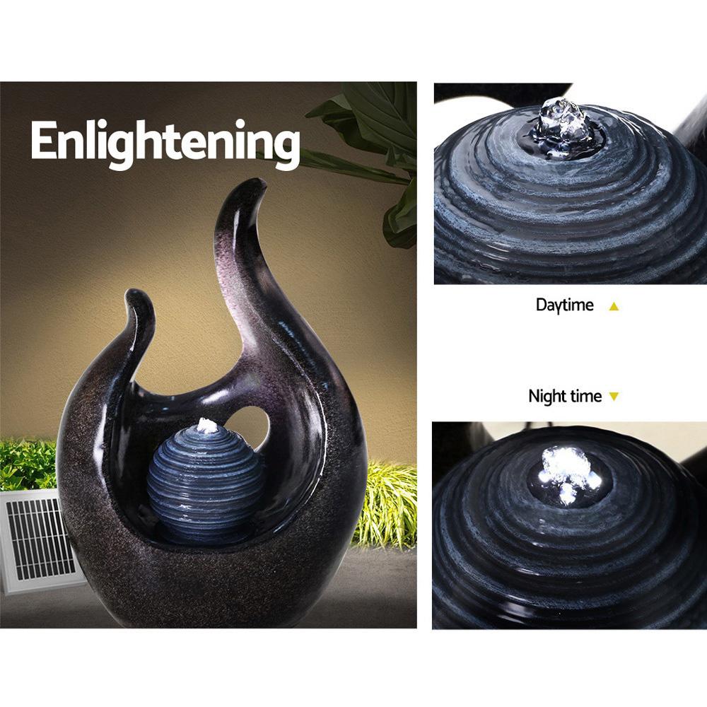Gardeon Solar Water Fountain featuring a 3-tier design with cascading water and a pearl, set in a garden environment.