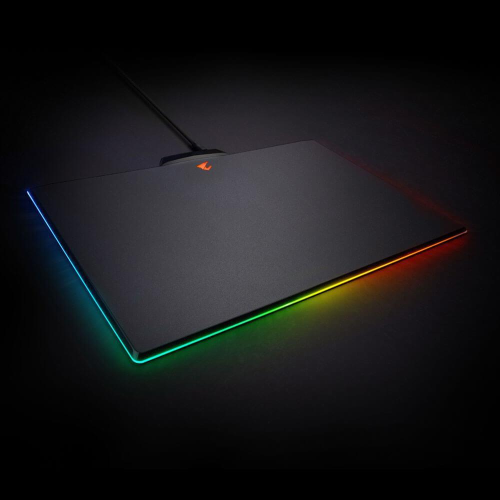 Gigabyte AORUS P7 RGB Fusion Gaming Mouse Pad with micro-textured surface and RGB lighting features, showcasing its sleek design and non-slip base.