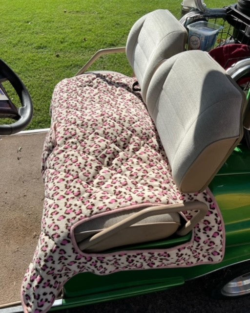 Padded and weatherproof golf cart seat covers with a cell phone pocket, designed for comfort and protection against the elements.