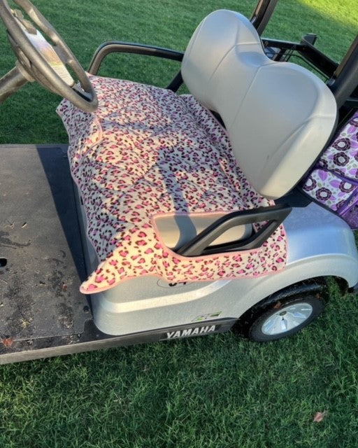 Padded and weatherproof golf cart seat covers with a cell phone pocket, designed for comfort and protection against the elements.