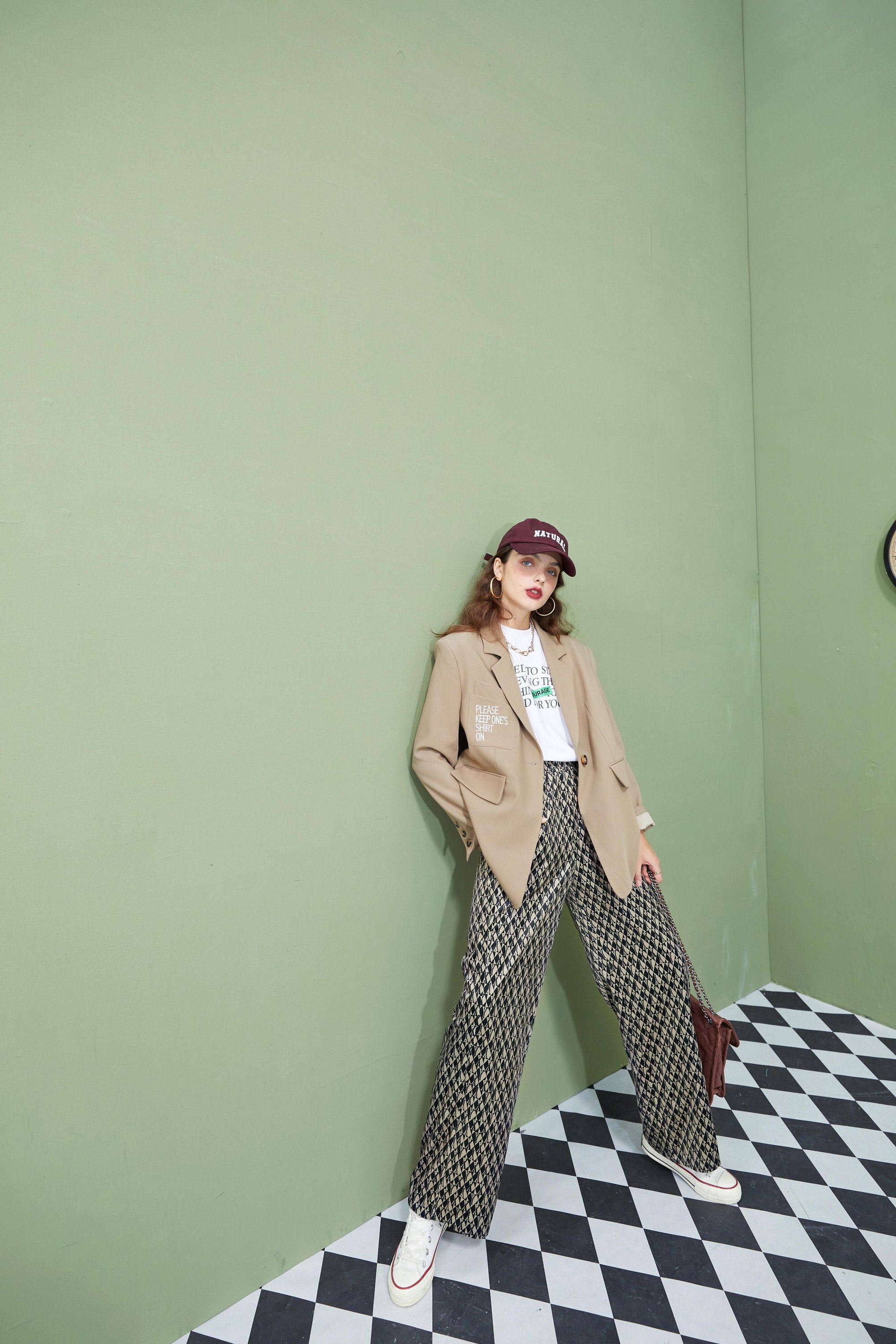 A pair of stylish graphic print high waist casual wide leg pants for women, showcasing a vintage design suitable for autumn wear.