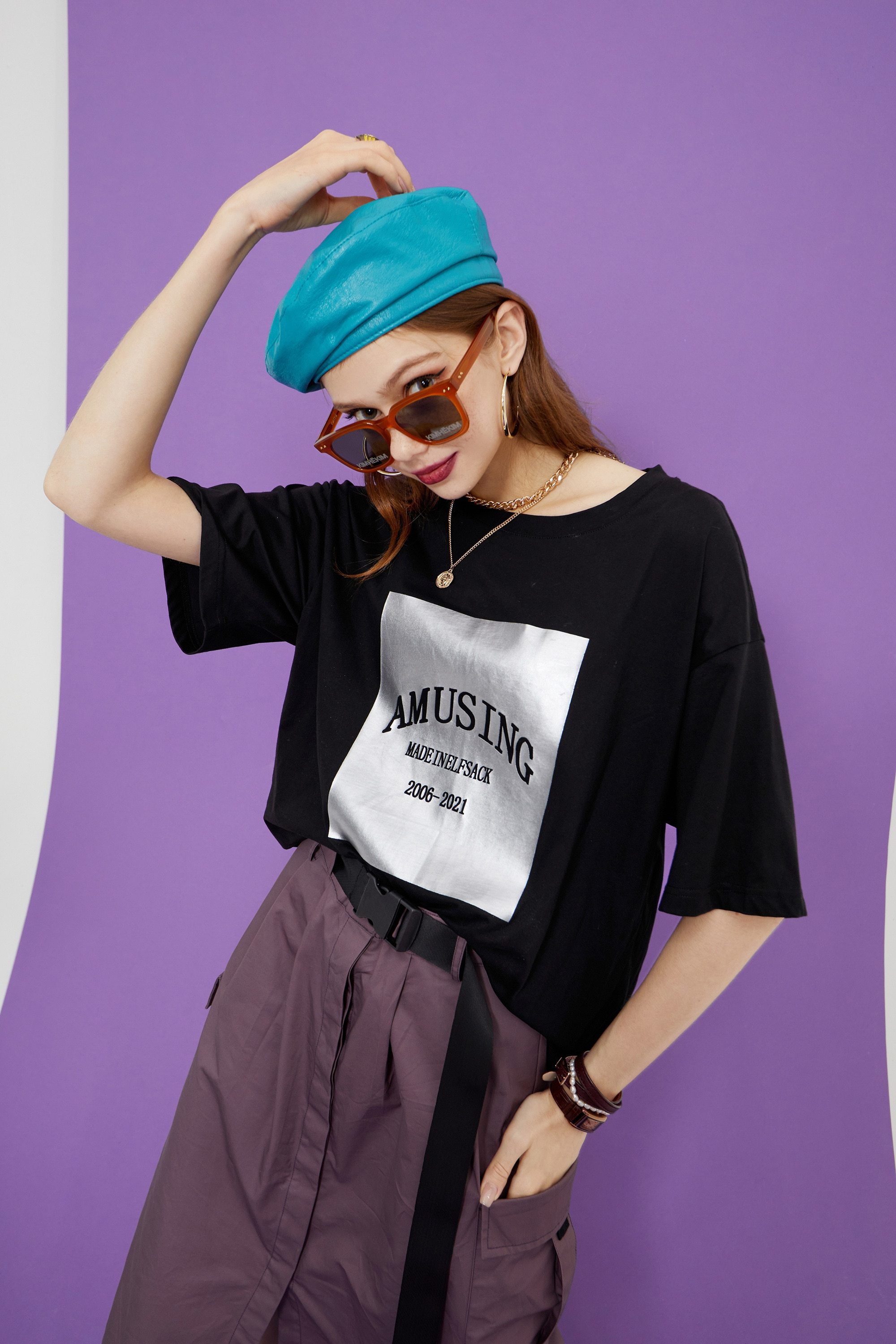 Harajuku Letter Painted Casual Oversized T-Shirt for Women, featuring a stylish letter design in a comfortable cotton fabric.