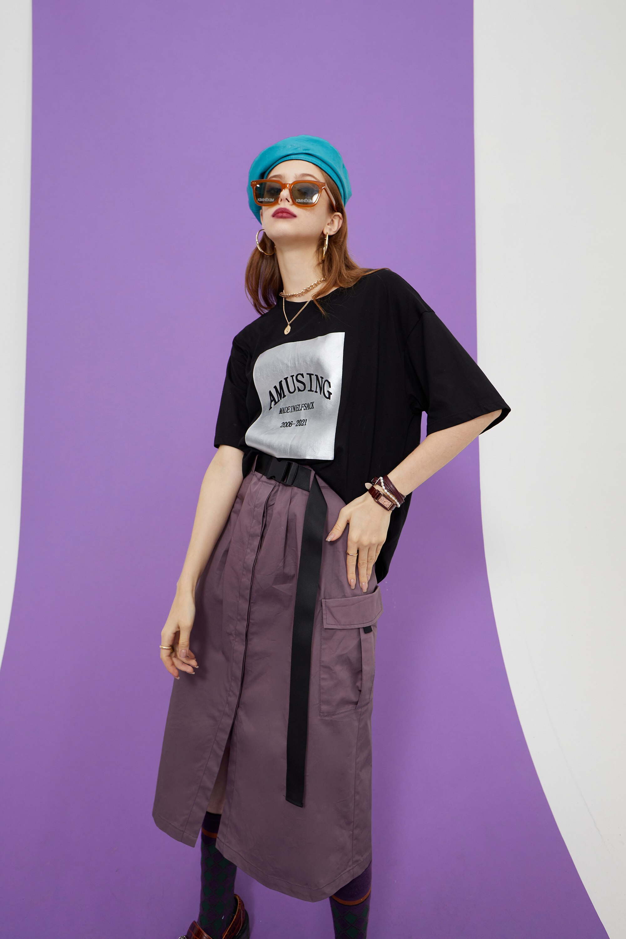 Harajuku Letter Painted Casual Oversized T-Shirt for Women, featuring a stylish letter design in a comfortable cotton fabric.