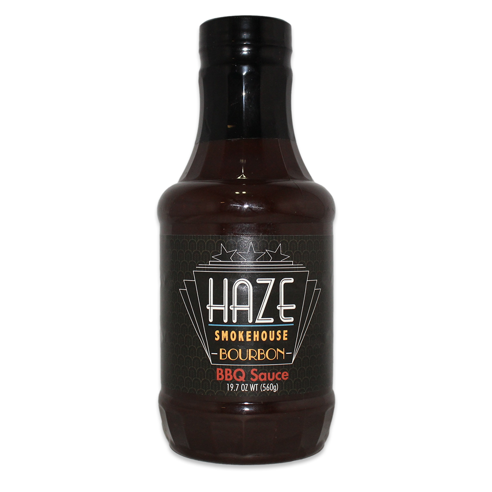 A bottle of Haze Smokehouse Bourbon BBQ Sauce, showcasing its rich color and label design, perfect for enhancing grilled dishes.