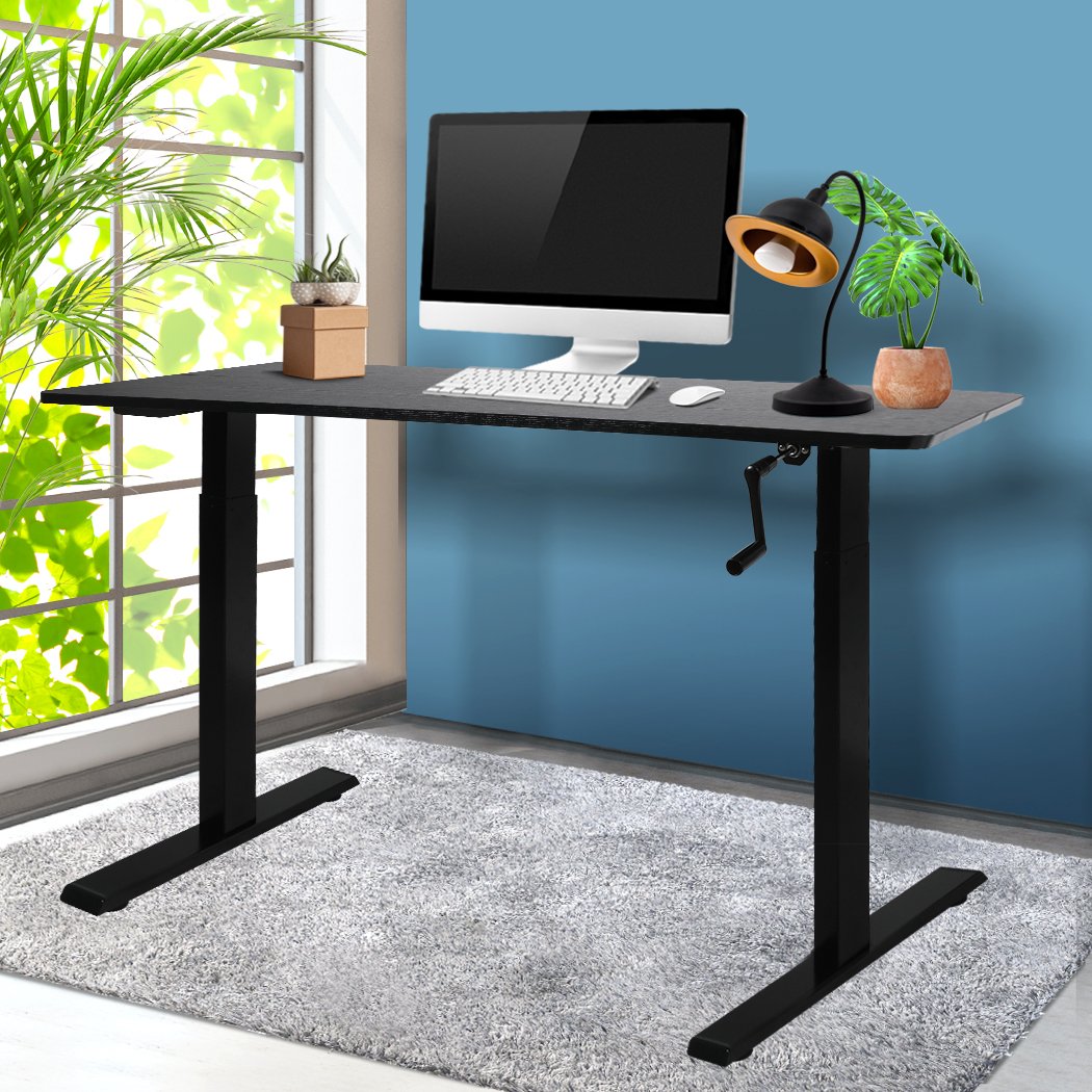 Height Adjustable Desk with a sleek black finish, showcasing its sturdy steel frame and spacious particle board surface.