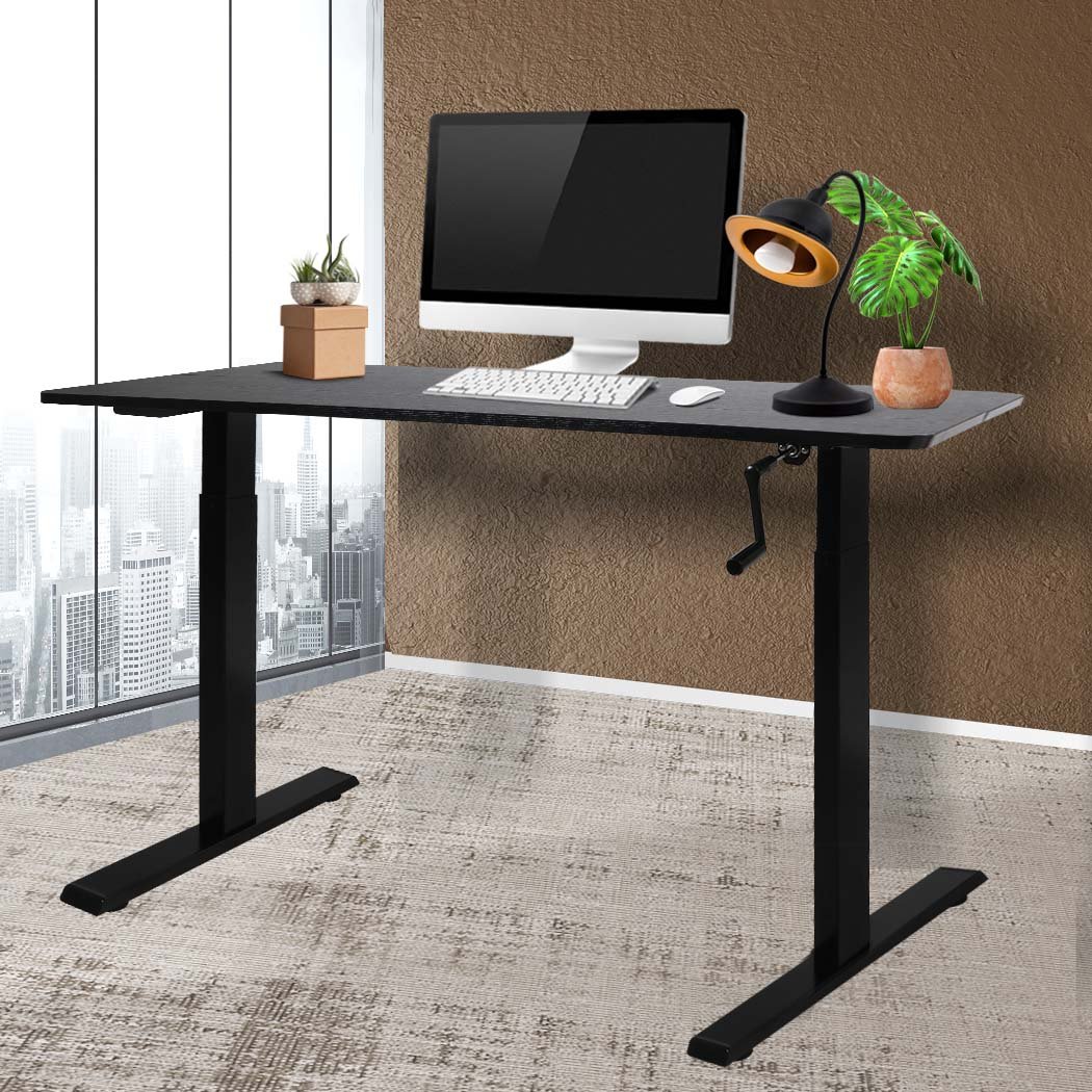 Height Adjustable Desk with a sleek black finish, showcasing its sturdy steel frame and spacious particle board surface.