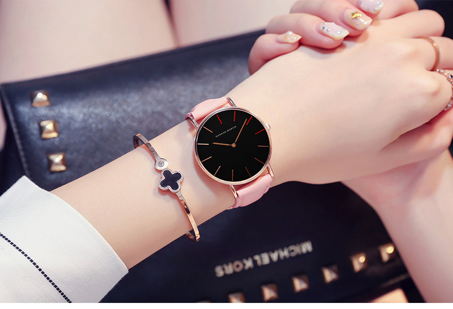 High Quality Japan Quartz Movement Women's Watch in rose gold and black leather, featuring a round case and elegant design.