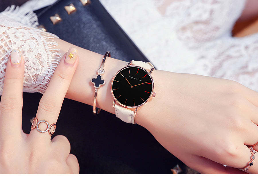 High Quality Japan Quartz Movement Women's Watch in rose gold and black leather, featuring a round case and elegant design.