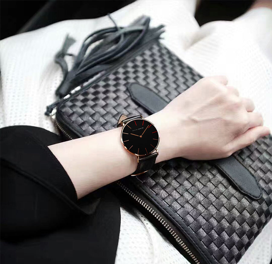 High Quality Japan Quartz Movement Women's Watch in rose gold and black leather, featuring a round case and elegant design.