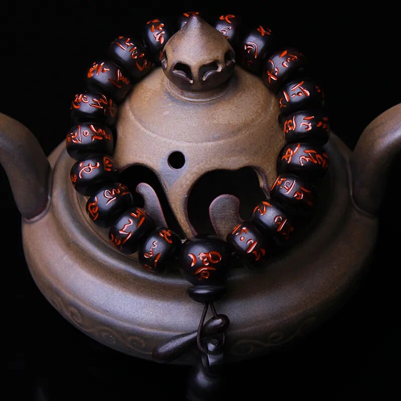 High quality Natural Lightning Peach Wood Buddha beads, hand carved, showcasing intricate details and a warm wood finish.