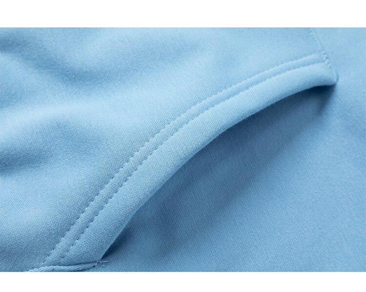 Men's colorful letter star-shaped fleece pullover hoodie in black, white, and blue, showcasing a casual college style.