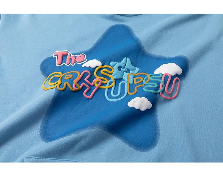 Men's colorful letter star-shaped fleece pullover hoodie in black, white, and blue, showcasing a casual college style.