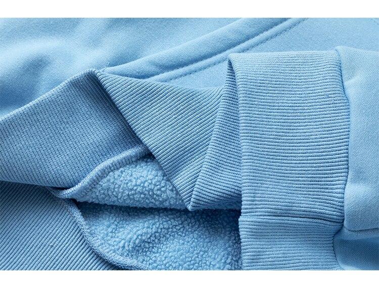 Men's colorful letter star-shaped fleece pullover hoodie in black, white, and blue, showcasing a casual college style.