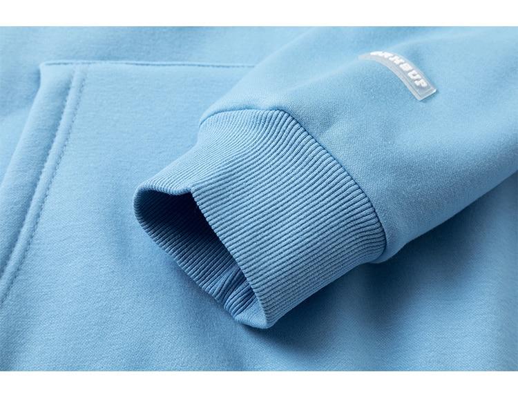 Men's colorful letter star-shaped fleece pullover hoodie in black, white, and blue, showcasing a casual college style.