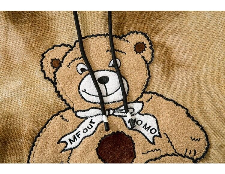 Oversized fleece hoodie for men featuring a cute furry bear patch, perfect for casual streetwear in gray and brown colors.