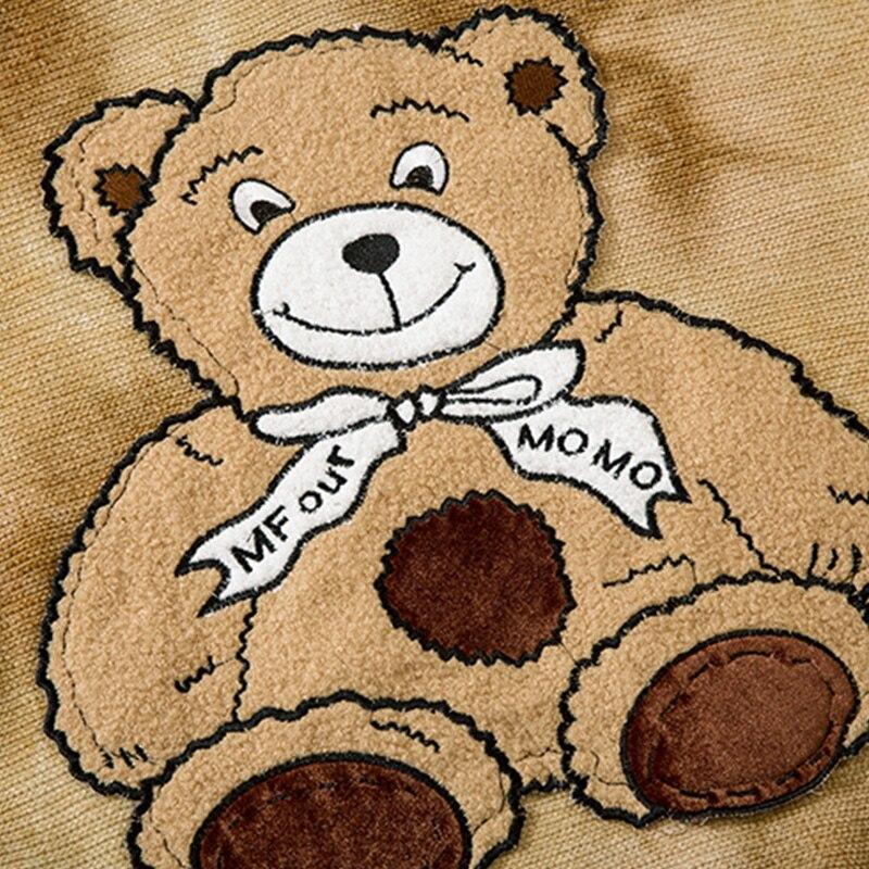 Oversized fleece hoodie for men featuring a cute furry bear patch, perfect for casual streetwear in gray and brown colors.