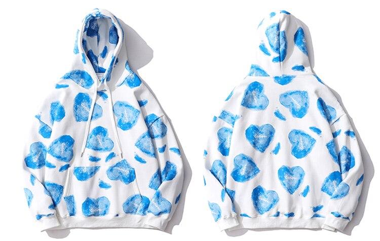 Men's hoodie featuring a heart inkjet print, big pocket, and soft velvet fabric in blue, pink, and yellow colors.