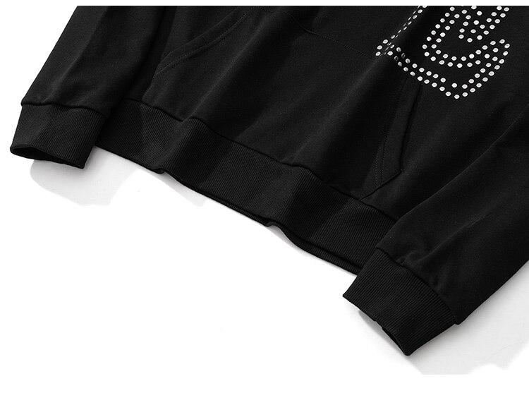 Oversized black hoodie for men featuring punk rivet details and melted letter print, perfect for autumn and winter streetwear.