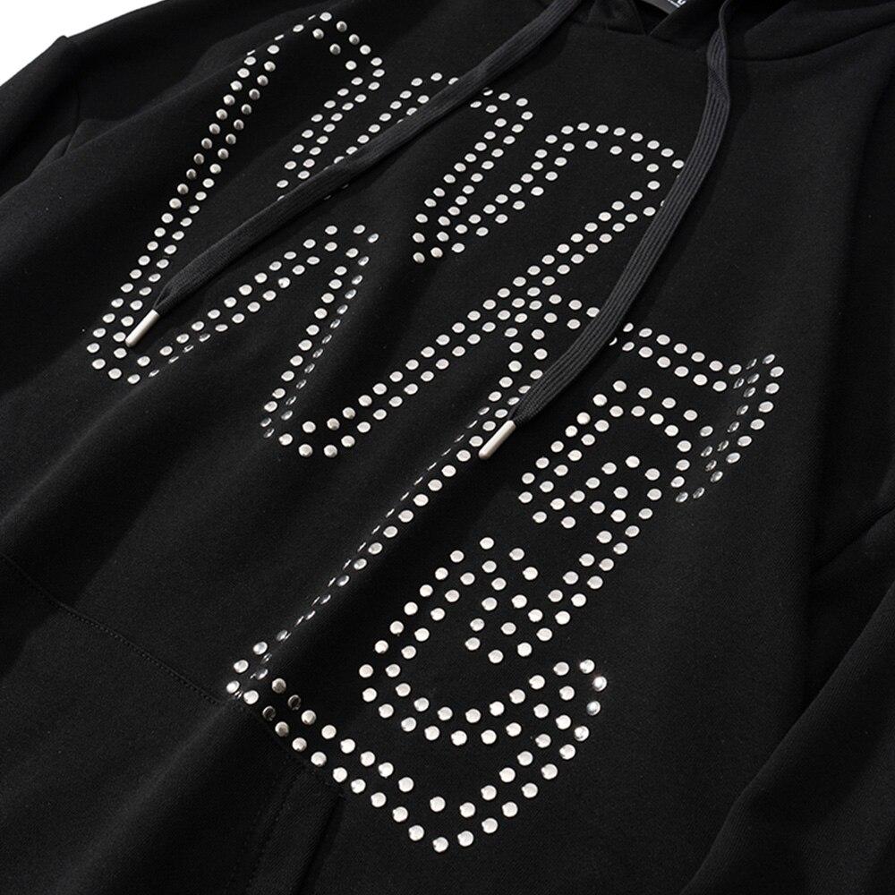 Oversized black hoodie for men featuring punk rivet details and melted letter print, perfect for autumn and winter streetwear.